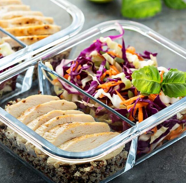 Nutrition Goals in NJ - A meal container filled with a vibrant, balanced salad including fresh greens, colorful vegetables, lean proteins, and healthy fats.